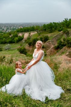 Dress with angel wings Swan dress Tulle dress Mother daughter dress Mommy and me dress Matching Long Dresses Dresses with wings White tulle dress Ivory tulle dress Matching Dresses100% REAL PHOTOS!!!!We guarantee you high quality tailoring and fabrics!Gorgeos long dress for mommy and me with embroidered wings - chic outfit for birthday, your special event, wedding or for a photo shoots!Color - ivory! ⚠️Please note that the colors of the objects on photos may differ from real. ⚠️MATERIALS:Tulle: Summer Fairy Style Dress With Tulle Skirt, Fairy Style Wedding Tutu Dress With Ruffles, White Fitted Fairy Dress, White Sleeveless Fairy Dress For Dress-up, Peach Tulle Dress, Tulle Maternity Dress, Swan Dress, White Tulle Dress, Mother Daughter Dress