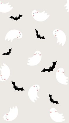 a group of bats flying through the air in front of a gray background with white ghost faces