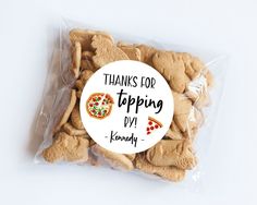 there is a bag of cookies that have been wrapped in plastic with the words thanks for tapping diy on it