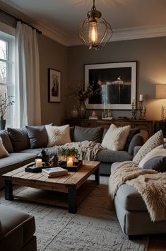 a living room filled with lots of furniture and pillows on top of a wooden table