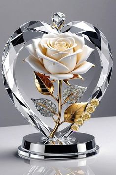 a crystal heart with a white rose in it's center on a reflective surface