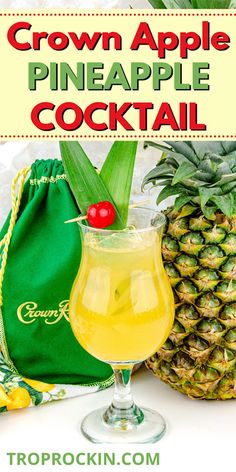 a pineapple cocktail in a glass next to some pineapples