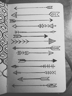 an open notebook with arrows drawn on it