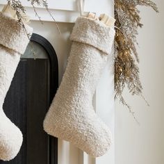 Our Boucle Stockings bring seasonal charm to a mantel or stair rail. The neutral, simple design adds beauty to the holidays, and don't worry: they're roomy enough to stash plenty of presents. KEY DETAILS 12"w x 18"h. 100% polyester shell. Sold individually. Made in China. Christmas Mantel Stocking Ideas, Modern Christmas Stockings Ideas, Neutral Stockings Christmas, Modern Organic Christmas, Sherpa Stocking, Xmas Room Decor, Hosting Era, Pirate Christmas, Beige Mom