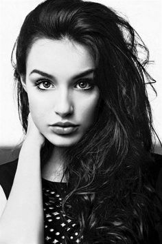 a black and white photo of a woman with long hair