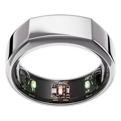 a ring with three green lights on it's sides and two black diamonds in the middle