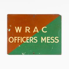 an orange and green sign that says wrac officers mess on the side of it