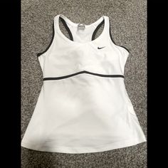 Euc. Never Worn. Training Tank With Built In Bra. Racer Back Style. Black Trim Detail. No Stains Rips, Or Piling. Size Medium Nike Fitted Tops With Built-in Bra, Nike Racerback Tank Top For Training, Nike Training Tank Top, Nike Moisture-wicking Tank Top, Nike Moisture-wicking Sportswear Tank Top, Tops Nike, Nike Training, Nike White, Nike Tops