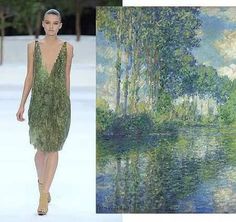 a woman in a green dress walking down a runway next to an image of trees