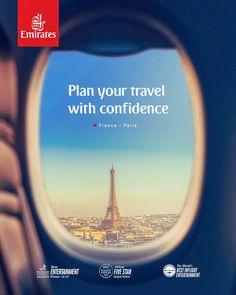 an airplane window with the eiffel tower seen through it