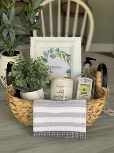 a basket filled with items sitting on top of a wooden table next to a potted plant