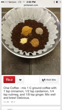 a metal bowl filled with food on top of a tiled floor