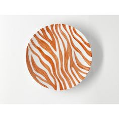 an orange and white plate with zebra print