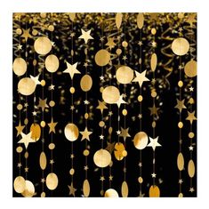 golden stars and moon hanging from strings against a black background with gold confetti