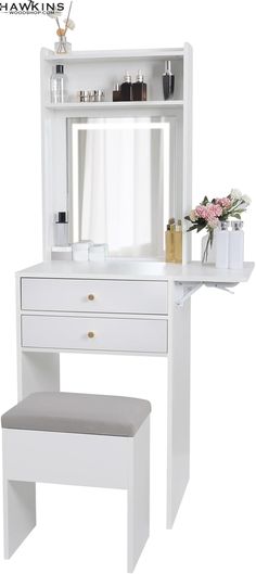 a white dressing table with a mirror and stool