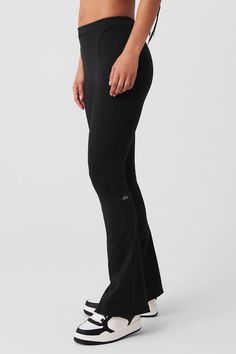 Switch up your go-to silhouette with the High-Waist 7/8 Zip It Flare Legging, made with our sculpting, breathable interlock fabric. It has a skinny waistband and invisible zippers at inside legs, so you can customize your flare. Soft & breathable interlock fabric 7/8 length with adjustable, zippered flare legs Designed & uniquely fit to flatter every size Wear-tested by our in-house team for the perfect fit Womens Black Pants, Flare Legging, Shopper Tote, Alo Yoga, Yoga Women, Invisible Zipper, Black Leggings, Desi, High Waist