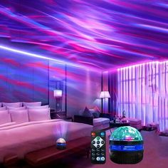 a bedroom with purple and blue lights on the ceiling