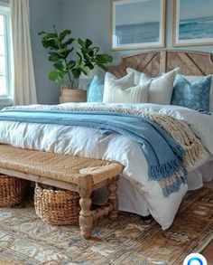 a bedroom with blue walls and white bedding, wicker baskets on the floor