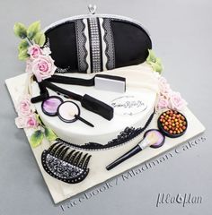 a cake with makeup and accessories on it