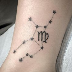 a tattoo with the zodiac sign and stars on it