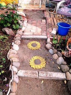 the sunflowers have been placed on the stone steps to create a garden path