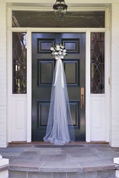 a purple dress hanging on the front door