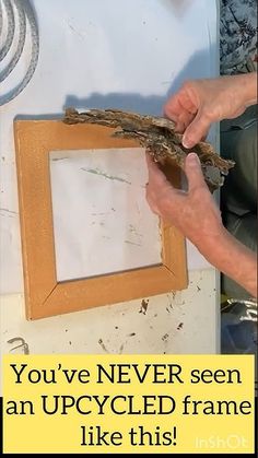 a man is holding up a picture frame with the words you've never seen an upcycled frame like this