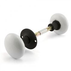 two black and white knobs on a white background