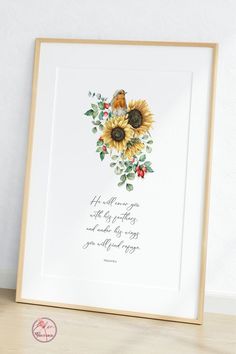 a sunflower with leaves and flowers on it is displayed in a wooden frame next to a