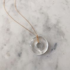 The sweetest donut—only you can’t eat it. Our Beignet Necklace is a great example of when minimalist meets maximalist. A dainty necklace is paired with a statement donut stone pendant to make something extraordinary. Choose your stone according to your flavor. 16", 18", 20", 22" Cable Link Chain Options 25mm Round Crystal No two stones are alike 14k Yellow Gold Filled or Sterling Silver Made in New York City Made to order, please allow 5-10 business days for production Top Rings, Heel Caps, Birthstone Necklace, Dainty Necklace, Stone Pendant, Signet Ring, Accessories Necklace, Vintage Accessories, Stone Pendants