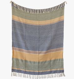 a blue and yellow striped blanket with fringes on the bottom, in front of a white background