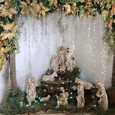 a nativity scene with figurines and lights