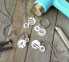 several different types of personalized items on a wooden table next to a hair dryer