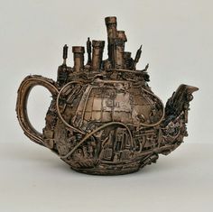 a teapot made out of metal parts