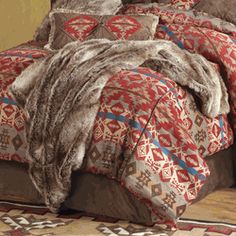 the comforter is made with red and brown colors