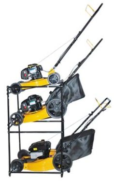 three fishing rods and two reels on a rack