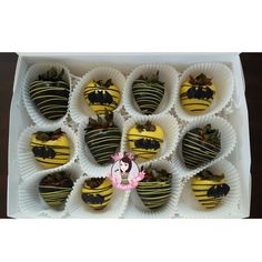 chocolate covered strawberries are arranged in the shape of heart shaped candies with yellow and black stripes