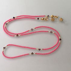 Buy 6 get 1  Free OR Buy 12 get 3 Free!! For wholesale orders, please get price information.   at least (100 pieces) Facemask Strap Holder quality bead used on this eyeglass hanger,gold filled apparatus Please select the "color of rubber parts" for the Eyeglass Chain Eyeglass holder: Beaded chain (23.5-inch) comes with rubber parts with adjustable metal coils at both ends. Please adjust to fit coils to the eyeglasses' temples. handmade eyeglass strap, bead eyeglass strap, eyeglass chain, crystal Trendy Pink Glasses Chains As Fashion Accessory, Trendy Pink Glasses Chains Fashion Accessory, Trendy Pink Glasses Chains For Fashion, Trendy Pink Glasses Chains, Eyeglass Chain Holders, Eyeglass Strap, Mask Strap