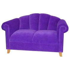 a purple couch sitting on top of a white floor