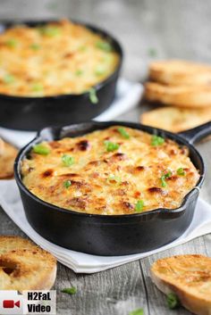 two black pans filled with cheesy bread