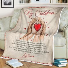 a blanket with two hands holding a red heart and the words my children written on it