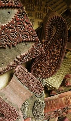 an assortment of decorative wooden items on display