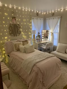 a bed room with a neatly made bed next to a chair and a desk in front of a window