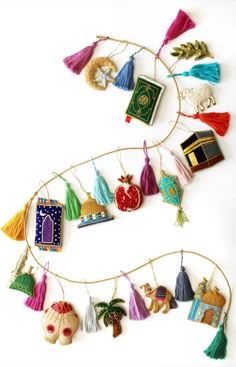 an assortment of ornaments hanging on a wall