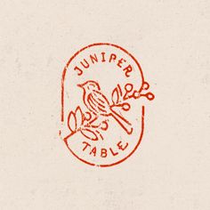 a red stamp on a white paper with the word summer table written in it and a bird