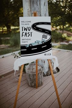 a sign that says welcome to two fast birthday party with a race car on it