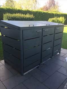 an outdoor storage unit with four drawers