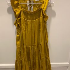 This Dress Is A Stunning Mustard Yellow Color, Is Made From A Soft Silk-Like Polyester, Featuring Gentle Ruffle Sleeves And Ties On The Back. It’s In Excellent Condition. I Did Remove The Tags, However, I Never Actually Wore It. Mustard Yellow Color, People Dress, Ruffle Sleeves, Free People Dresses, Free People Dress, Gold Yellow, Mustard Yellow, Dresses Xs, Yellow Color