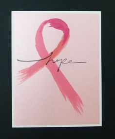 a pink ribbon with the word hope written in cursive writing on it,