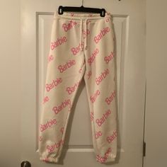 A Pair Of Fleece Joggers Featuring Allover "Barbie" Graphics And An Elasticized Drawstring Waistband. Runs Small. Sold Out Online Content + Care - 58% Cotton, 42% Polyester - Machine Wash Cold Pet & Smoke-Free Home Questions? Leave A Comment Below! Make Me An Offer :) Fitted Pink Sweatpants With Elastic Waistband, Forever 21 Casual Loungewear Bottoms, Trendy Pink Letter Print Pants, Trendy Pink Sweatpants With Letter Print, Trendy Fitted Pink Sweatpants, Forever 21 Stretch Loungewear Bottoms, Forever 21 Stretch Mini Bottoms, Forever 21 Cotton Loungewear Bottoms, Forever 21 Sweatpants